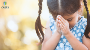 young child praying