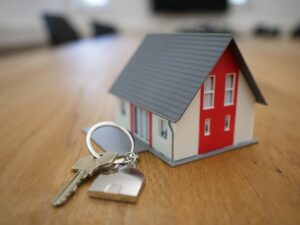 small house with a set of house keys